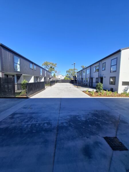 Completed concrete shared accessway at the Manukau townhouse development with StormSlab detention beneath
