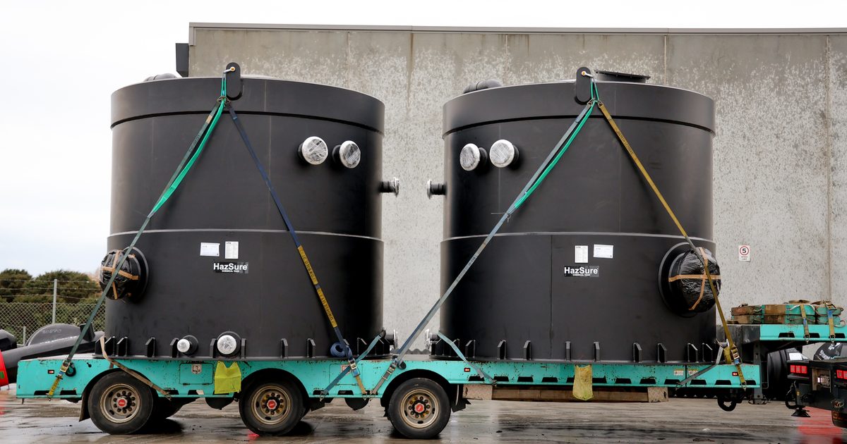 Two HazSure IL4 HDPE tanks strapped side by side on a trailer at the Pukete Wastewater Treatment Plant
